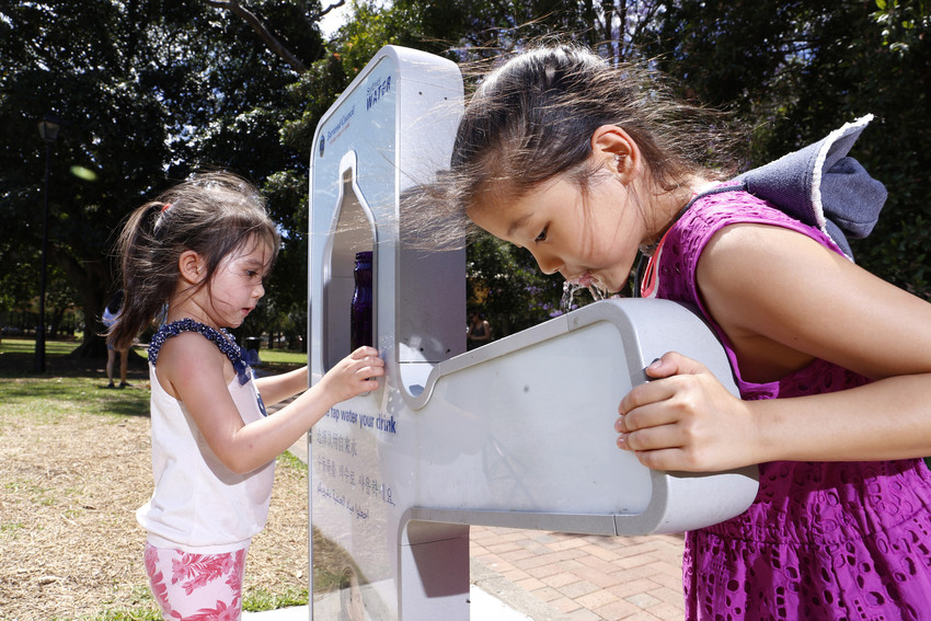 Children drinking from water refill station