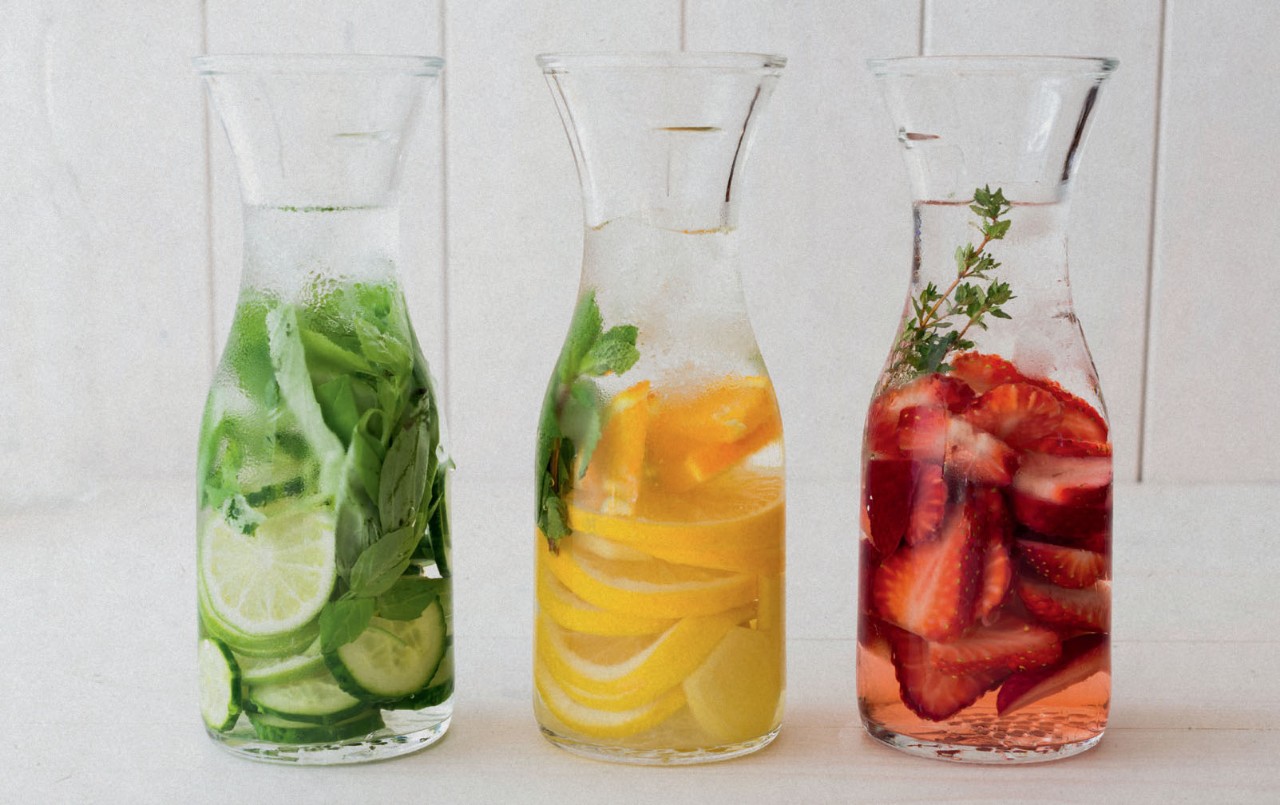 Carafes with drinking water and fruit and veg.
