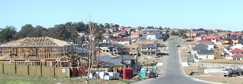 Houses being constructed next to road