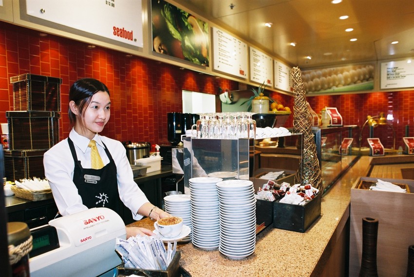 Girl at counter in food service area