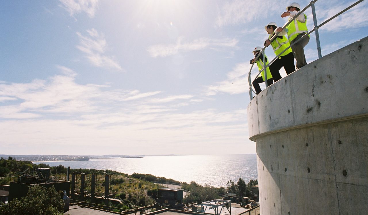 Staff at North Head overlooking the coastline